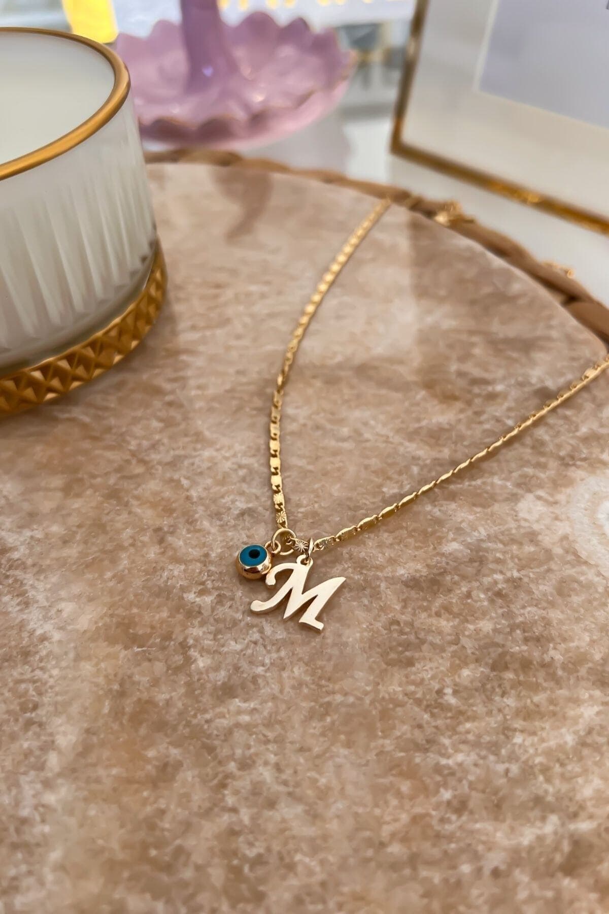 گردنبند حرف M Trendy Butik با مهره چشمزخم و زنجیر ظریف گردنبند حرف M Trendy Butik با مهره چشمزخم و زنجیر ظریف