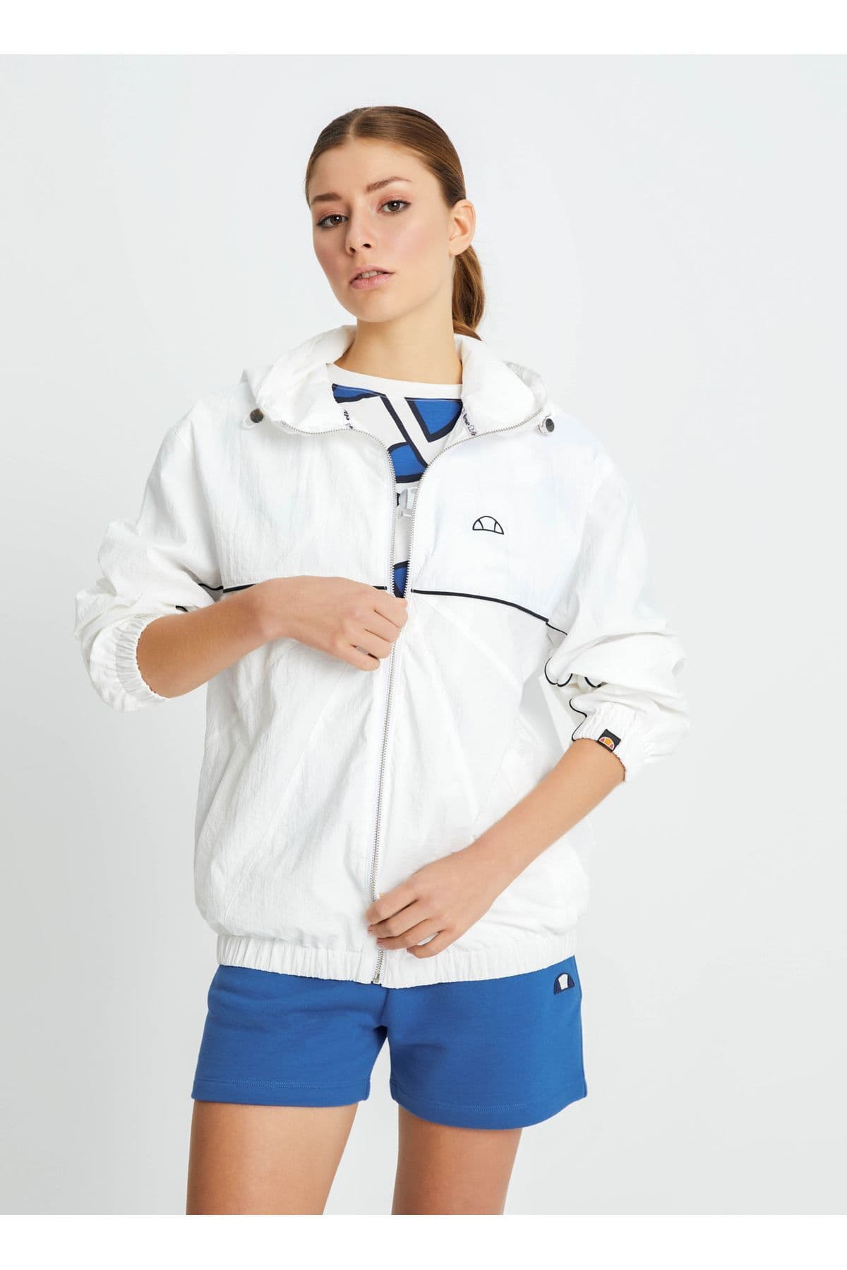 بادگیر زنانه Ellesse سفید شکسته مدل EF100-OF بادگیر زنانه Ellesse سفید شکسته مدل EF100-OF