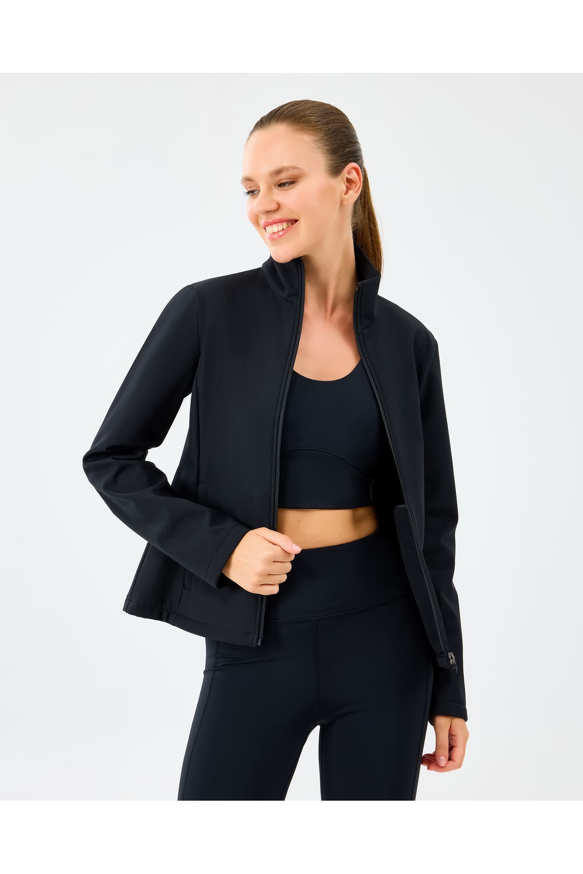 کاپشن زنانه Skechers Softshell فیت یقه اسکی مشکی مدل S2520190-3817 کاپشن زنانه Skechers Softshell فیت یقه اسکی مشکی مدل S2520190-3817