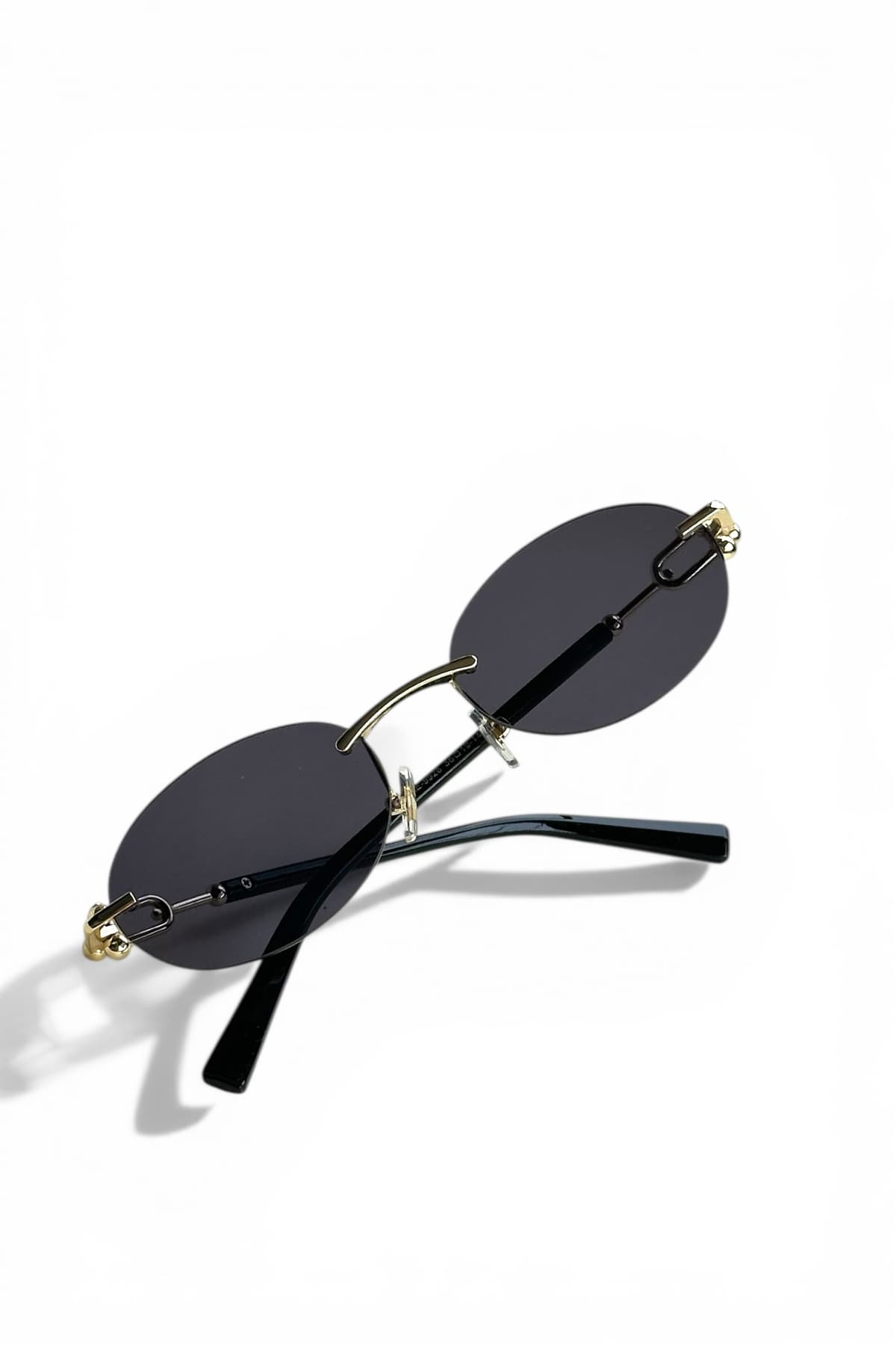 عینک آفتابی زنانه REN EYEWEAR فلزی بیضی مشکی با جزئیات طلایی UV400 مدل DERLA عینک آفتابی زنانه REN EYEWEAR فلزی بیضی مشکی با جزئیات طلایی UV400 مدل DERLA