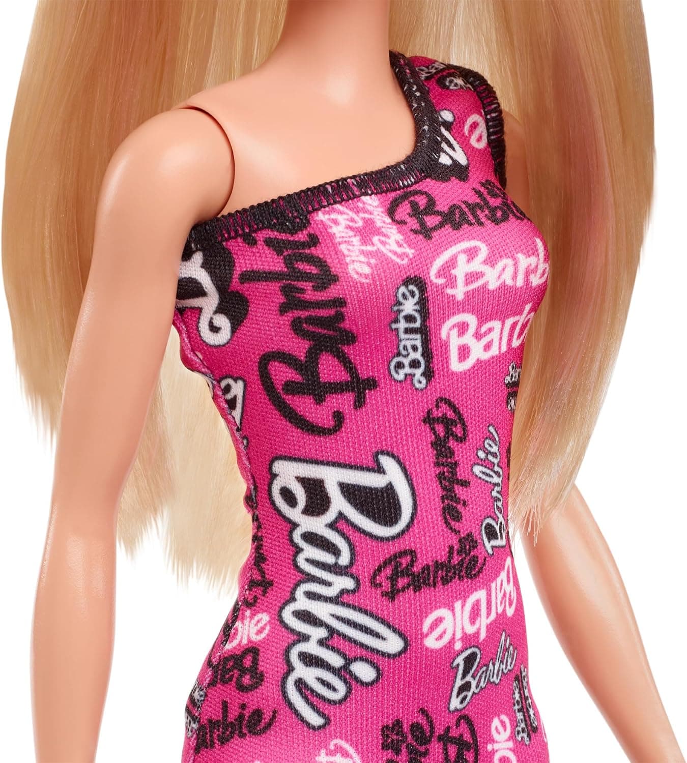 عروسک مد Barbie با موهای بلوند صاف، لباس صورتی جداشدنی و کفشهای لوگودار عروسک مد Barbie با موهای بلوند صاف، لباس صورتی جداشدنی و کفشهای لوگودار
