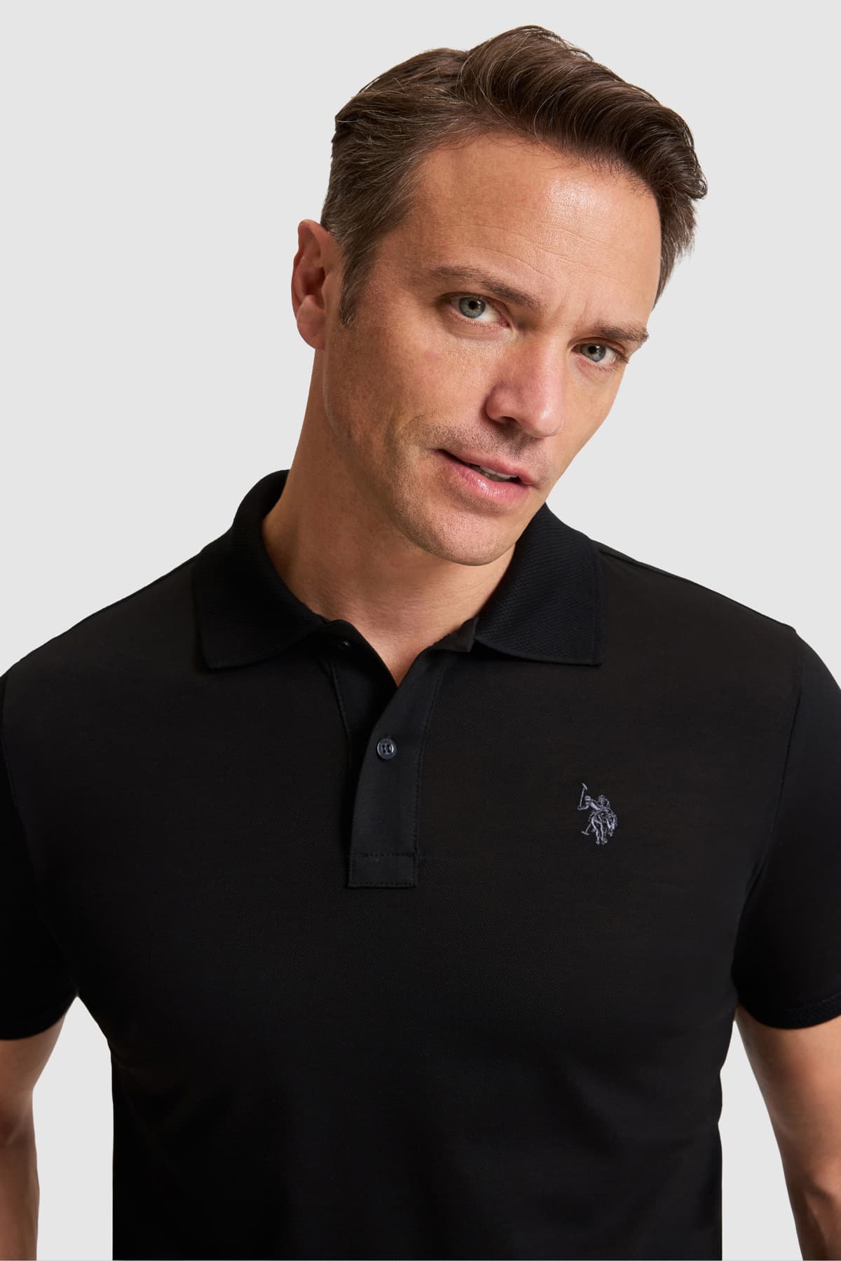 تیشرت مردانه U.S. Polo Assn. ساده مشکی فیت معمولی یقه پولو مدل 50322297-VR046 تیشرت مردانه U.S. Polo Assn. ساده مشکی فیت معمولی یقه پولو مدل 50322297-VR046