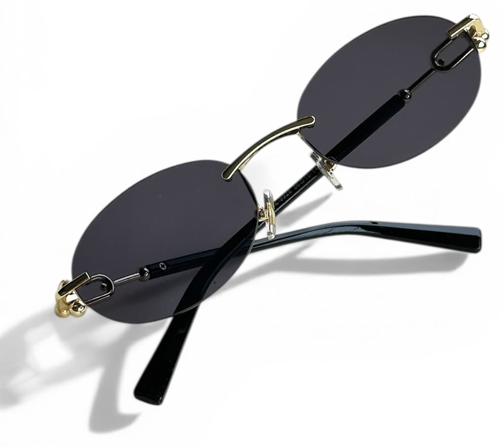 عینک آفتابی زنانه REN EYEWEAR فلزی بیضی مشکی با جزئیات طلایی UV400 مدل DERLA عینک آفتابی زنانه REN EYEWEAR فلزی بیضی مشکی با جزئیات طلایی UV400 مدل DERLA