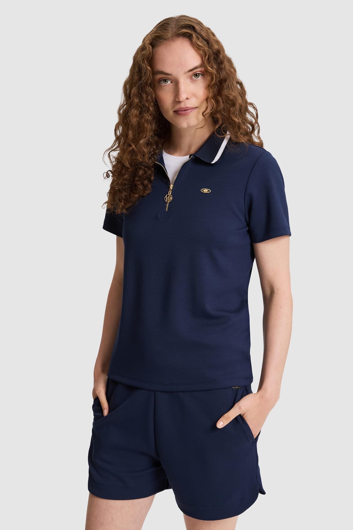 تیشرت زنانه U.S. Polo Assn. یقه پولو نیمزیپ سرمهای مدل 50323481-VR033 تیشرت زنانه U.S. Polo Assn. یقه پولو نیمزیپ سرمهای مدل 50323481-VR033