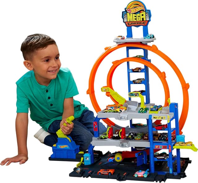 ست پیست ماشین اسباببازی Hot Wheels با هلیکوپتر و 2 حلقه مدل Mega Loop Garage ست پیست ماشین اسباببازی Hot Wheels با هلیکوپتر و 2 حلقه مدل Mega Loop Garage
