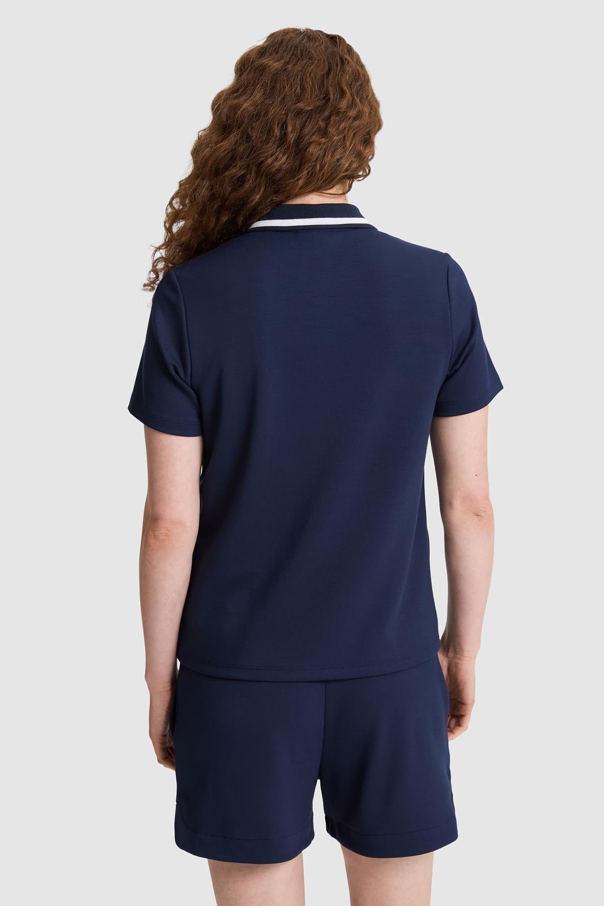 تیشرت زنانه U.S. Polo Assn. یقه پولو نیمزیپ سرمهای مدل 50323481-VR033 تیشرت زنانه U.S. Polo Assn. یقه پولو نیمزیپ سرمهای مدل 50323481-VR033