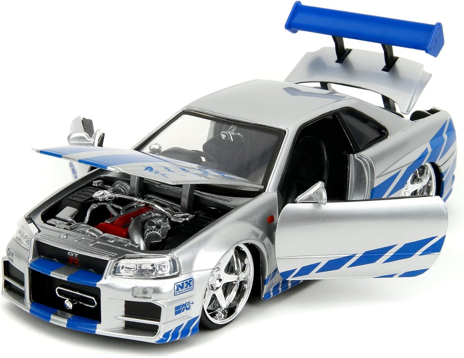 ماشین فلزی Jada از مجموعه Fast & Furious مدل 2002 Nissan Skyline R34، مقیاس 1:24، نقرهای و آبی ماشین فلزی Jada از مجموعه Fast & Furious مدل 2002 Nissan Skyline R34، مقیاس 1:24، نقرهای و آبی