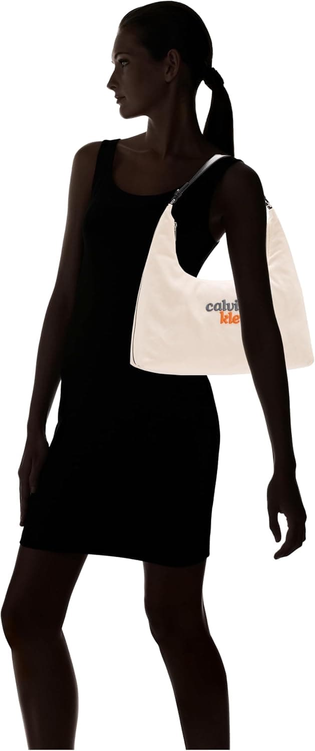 کیف دوشی زنانه Calvin Klein سفید مدل GRAPHIC CANVAS MEDIUM SHOULDER B کیف دوشی زنانه Calvin Klein سفید مدل GRAPHIC CANVAS MEDIUM SHOULDER B