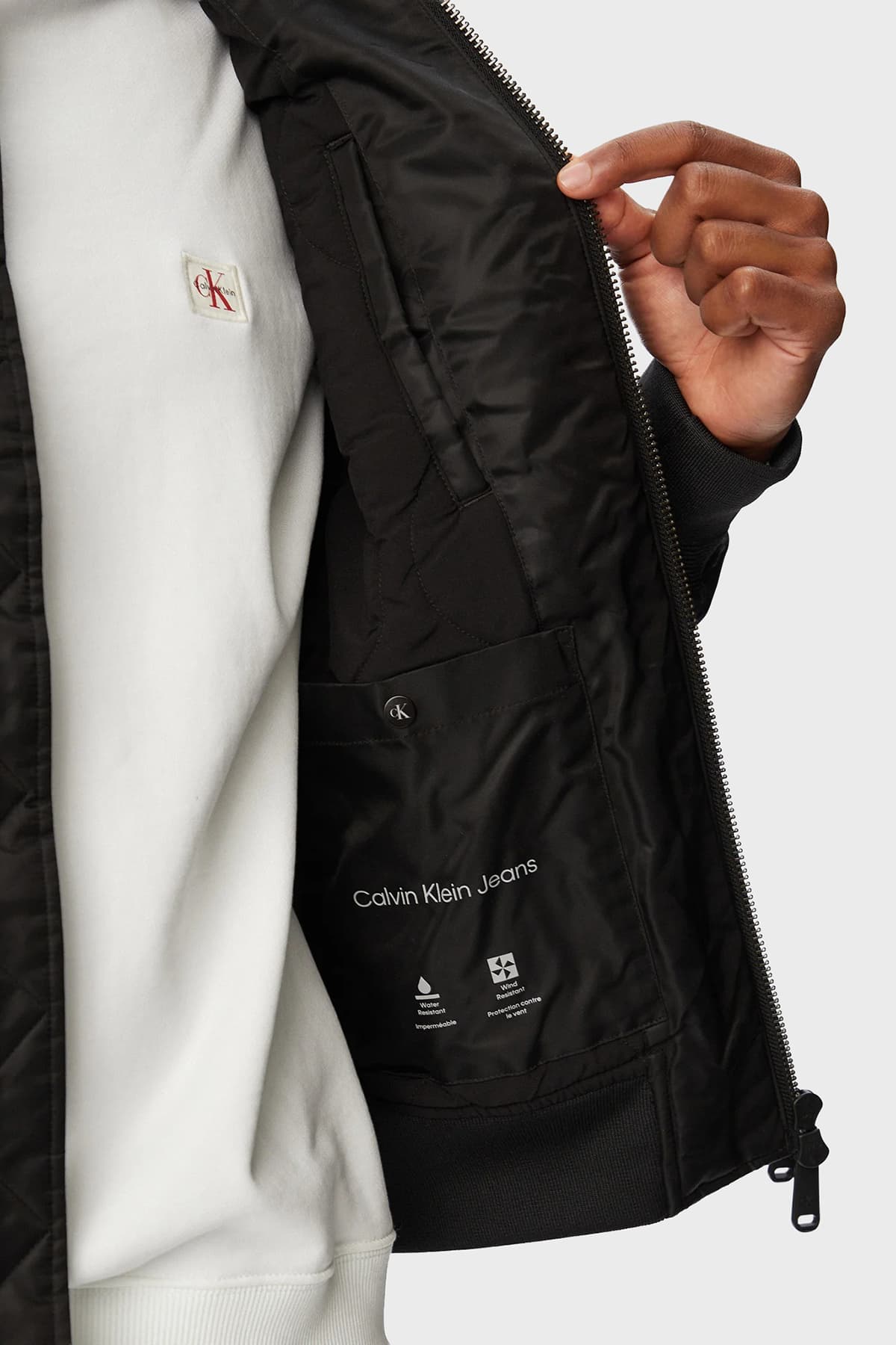 کاپشن مردانه Calvin Klein دافع آب فیت ریلکس یقه کالج مدل LV04RG505GUB1 کاپشن مردانه Calvin Klein دافع آب فیت ریلکس یقه کالج مدل LV04RG505GUB1