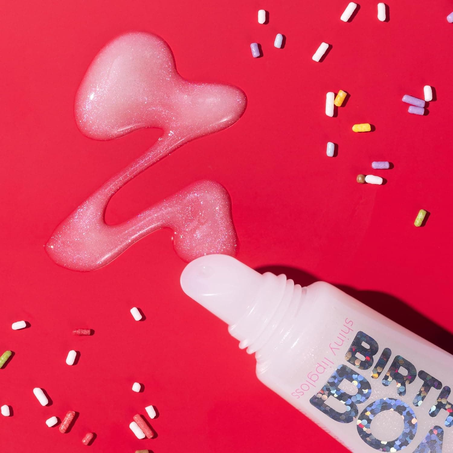 لیپگلاس براق Essence Cosmetics Birthday Bomb مدل 01 لیپگلاس براق Essence Cosmetics Birthday Bomb مدل 01