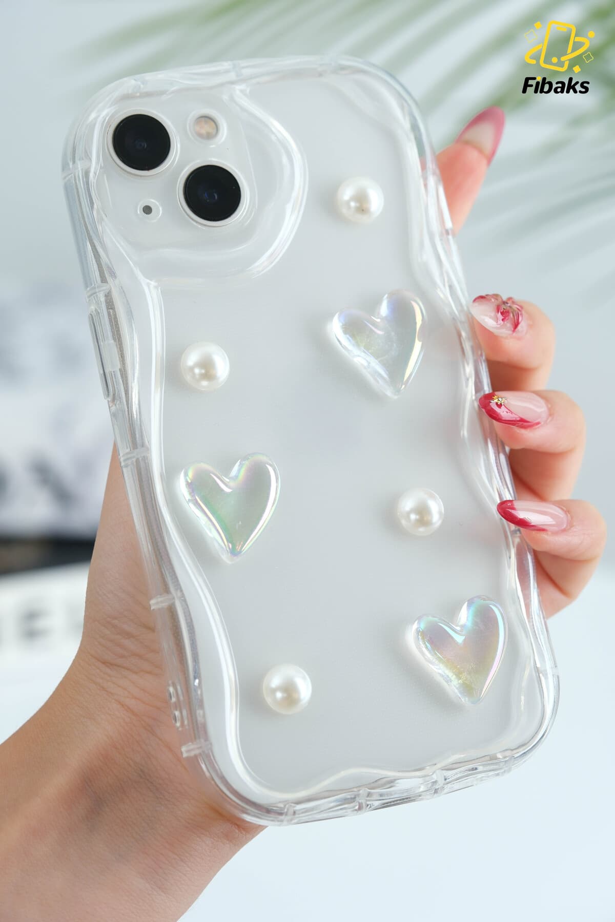 قاب گوشی Fibaks سیلیکونی شفاف طرح قلب و مروارید سه بعدی محافظ دوربین iPhone 13/14 قاب گوشی Fibaks سیلیکونی شفاف طرح قلب و مروارید سه بعدی محافظ دوربین iPhone 13/14