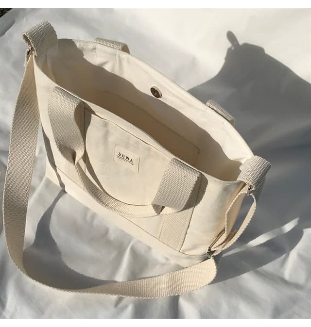 کیف دستی و دوشی زنانه Sowa Collection کانواس با دکمه فشاری و بند قابل تنظیم U:30 E:35 G:10 Cm کیف دستی و دوشی زنانه Sowa Collection کانواس با دکمه فشاری و بند قابل تنظیم U:30 E:35 G:10 Cm