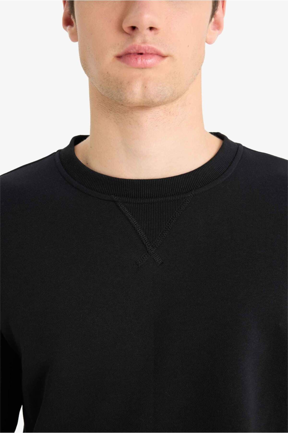 سویشرت یقه گرد ساده ضخیم فیت معمولی Defacto مدل T3777AZ23AU سویشرت یقه گرد ساده ضخیم فیت معمولی Defacto مدل T3777AZ23AU