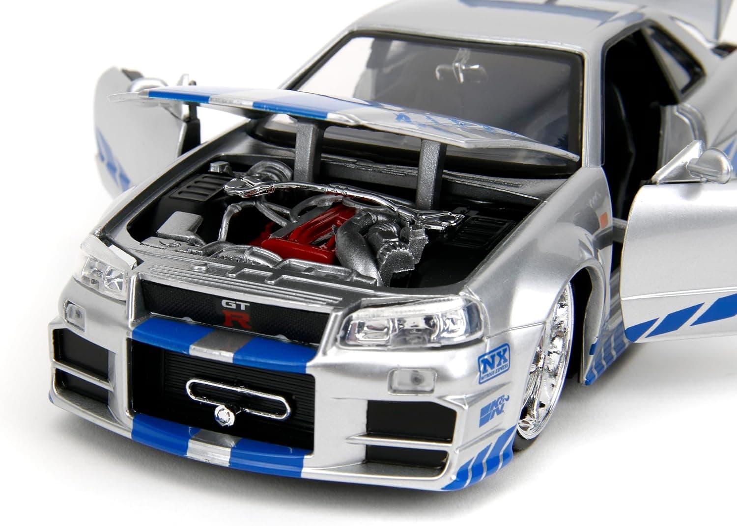 ماشین فلزی Jada از مجموعه Fast & Furious مدل 2002 Nissan Skyline R34، مقیاس 1:24، نقرهای و آبی ماشین فلزی Jada از مجموعه Fast & Furious مدل 2002 Nissan Skyline R34، مقیاس 1:24، نقرهای و آبی