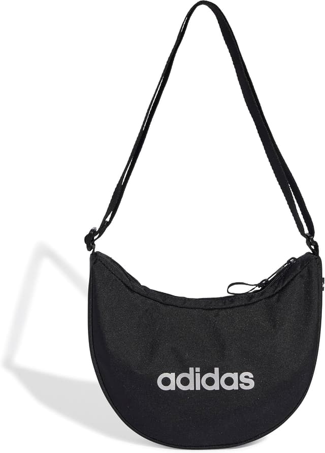 کیف دوشی یونیسکس adidas مدل W L ESS POUCH مشکی/نقرهای متالیک استاندارد کیف دوشی یونیسکس adidas مدل W L ESS POUCH مشکی/نقرهای متالیک استاندارد