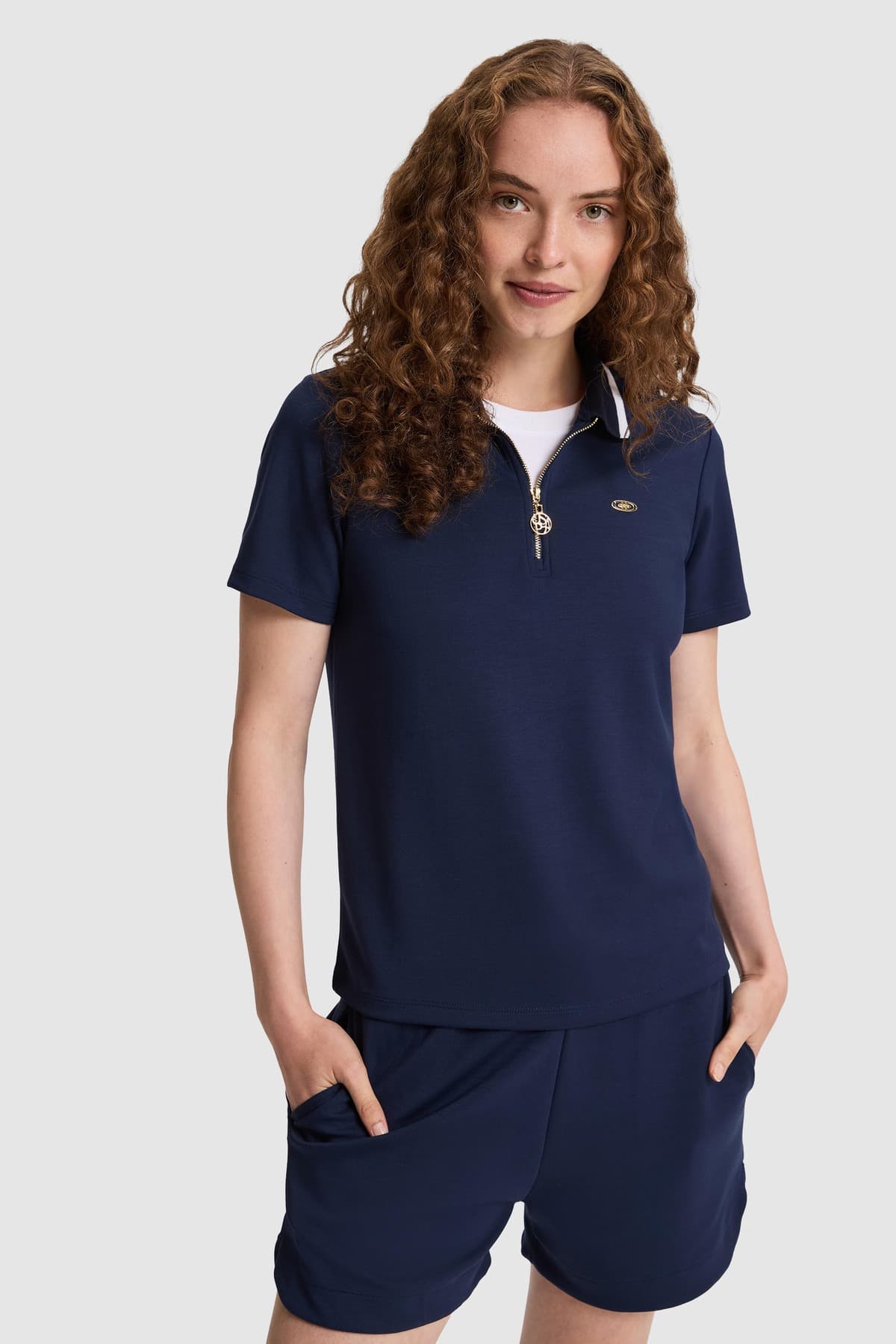 تیشرت زنانه U.S. Polo Assn. یقه پولو نیمزیپ سرمهای مدل 50323481-VR033 تیشرت زنانه U.S. Polo Assn. یقه پولو نیمزیپ سرمهای مدل 50323481-VR033