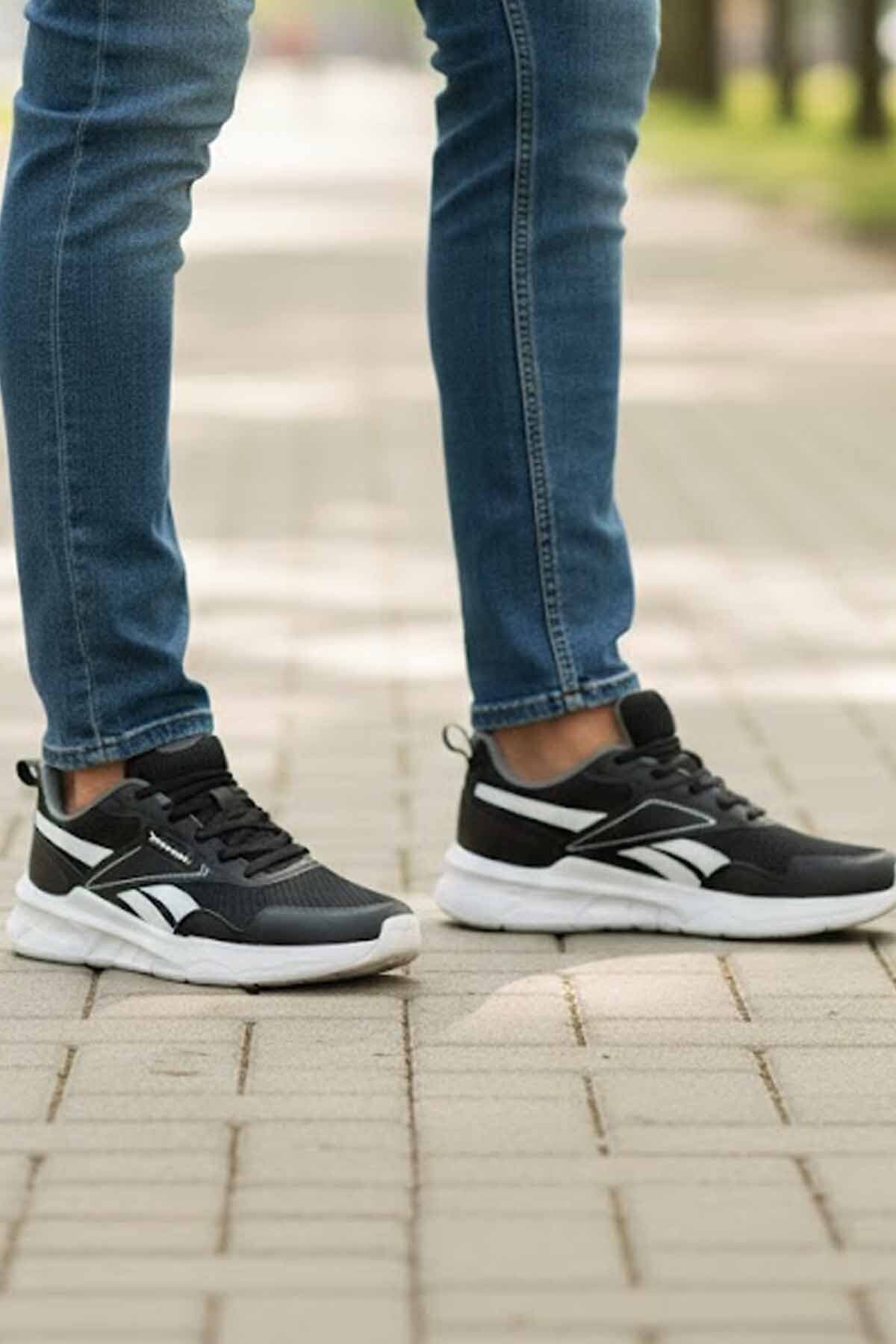 کفش ورزشی مردانه Reebok مشکیوسفید با زیره سبک و قالب راحت مدل C1 کفش ورزشی مردانه Reebok مشکیوسفید با زیره سبک و قالب راحت مدل C1