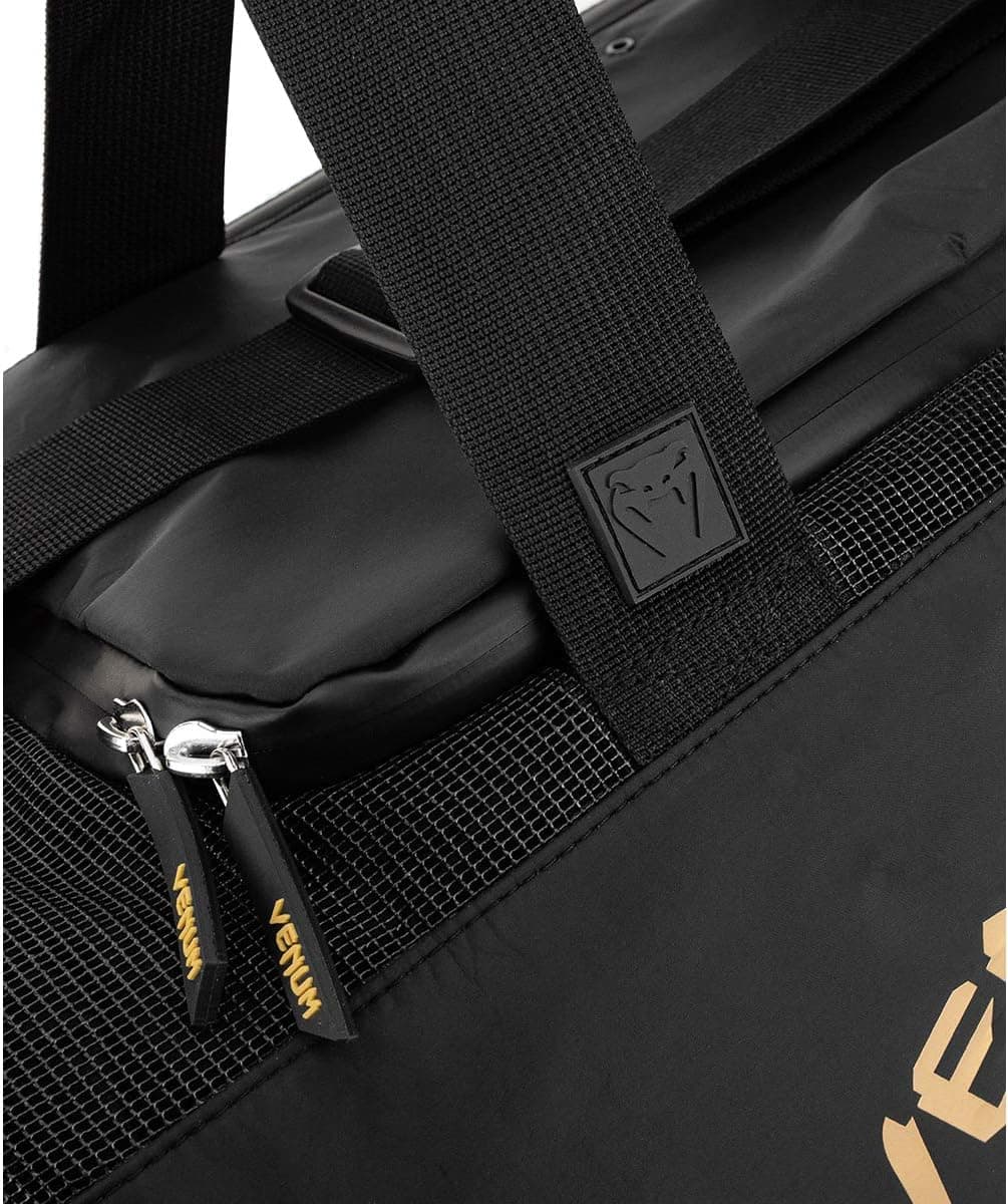 کیف ورزشی یونیسکس بزرگسال Venum Trainer Lite Evo تکسایز مشکی/طلایی کیف ورزشی یونیسکس بزرگسال Venum Trainer Lite Evo تکسایز مشکی/طلایی